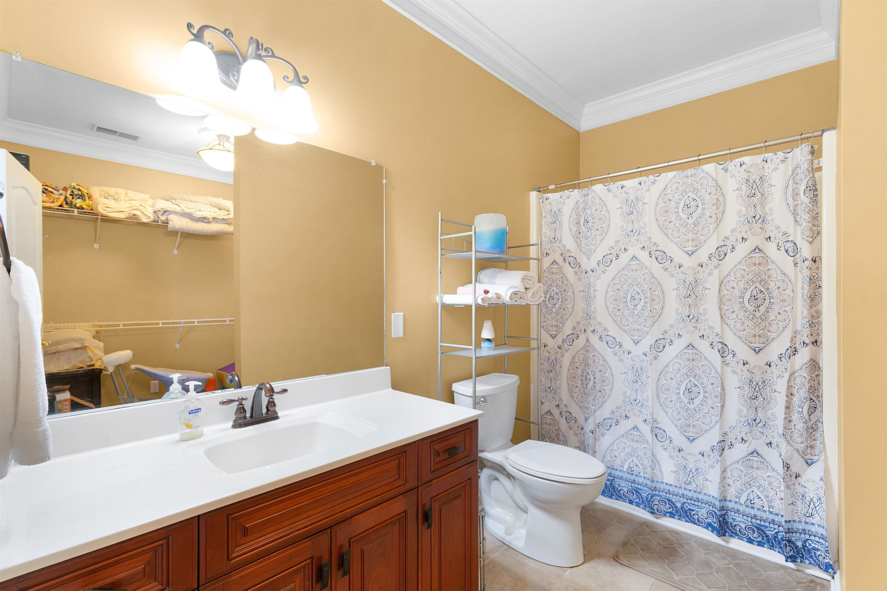189 Rust Road Bells, TN 38006 - Photo 24 of 33 a bathroom with a sink a toilet and shower curtain