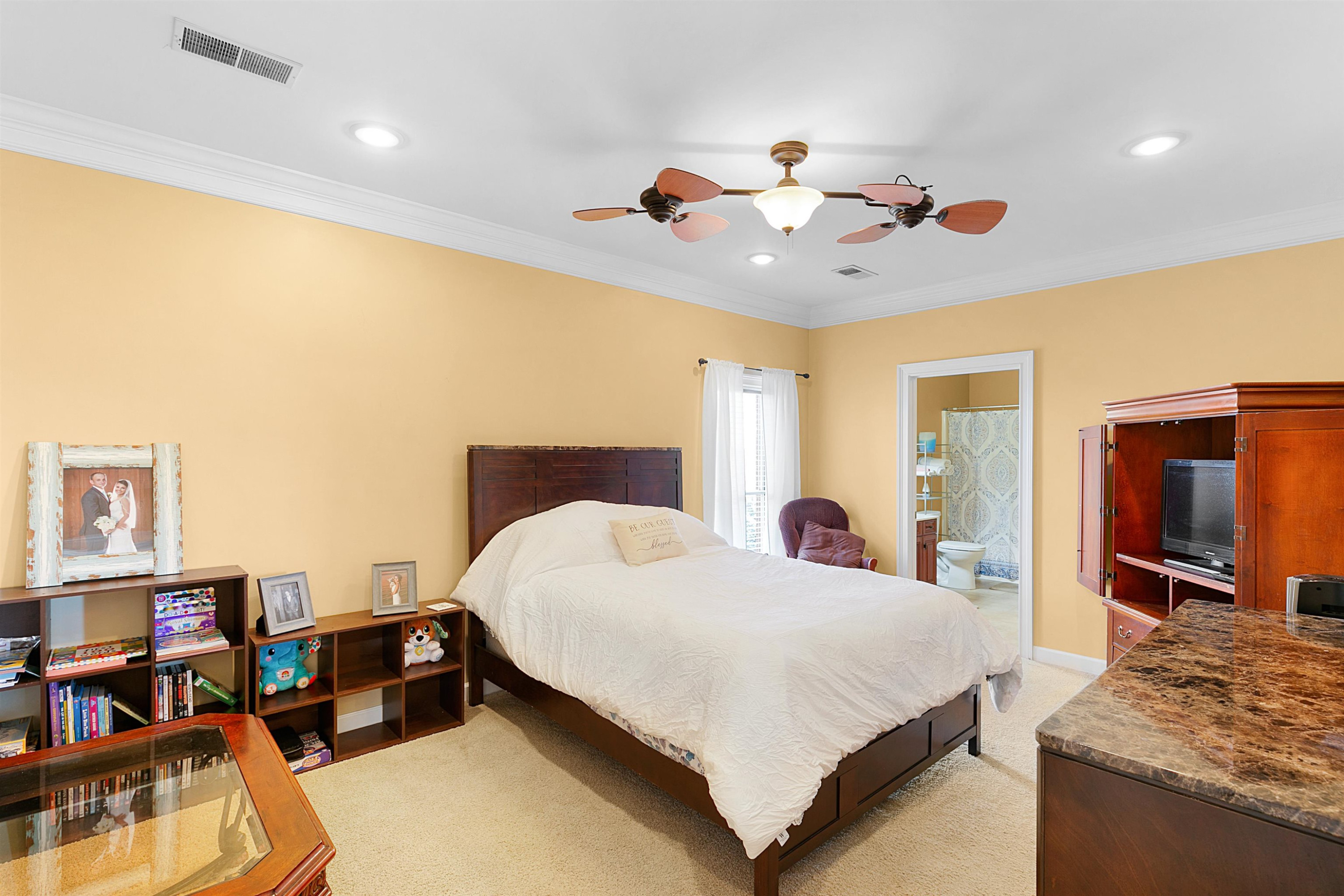 189 Rust Road Bells, TN 38006 - Photo 25 of 33 a bedroom with a bed and a flat screen tv