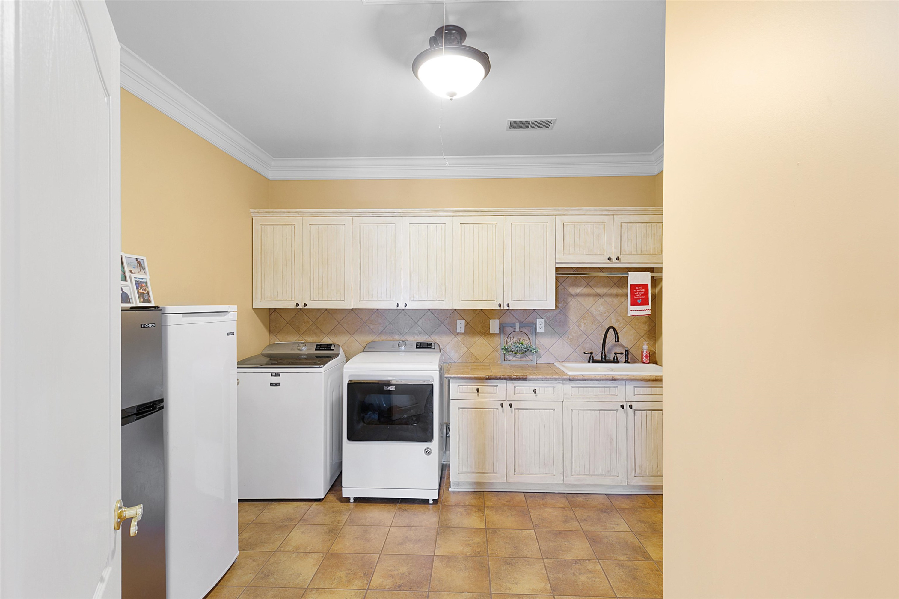189 Rust Road Bells, TN 38006 - Photo 27 of 33 a kitchen with a sink and a stove top oven