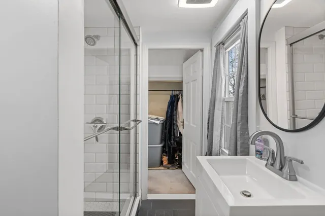 a bathroom with a sink and a mirror