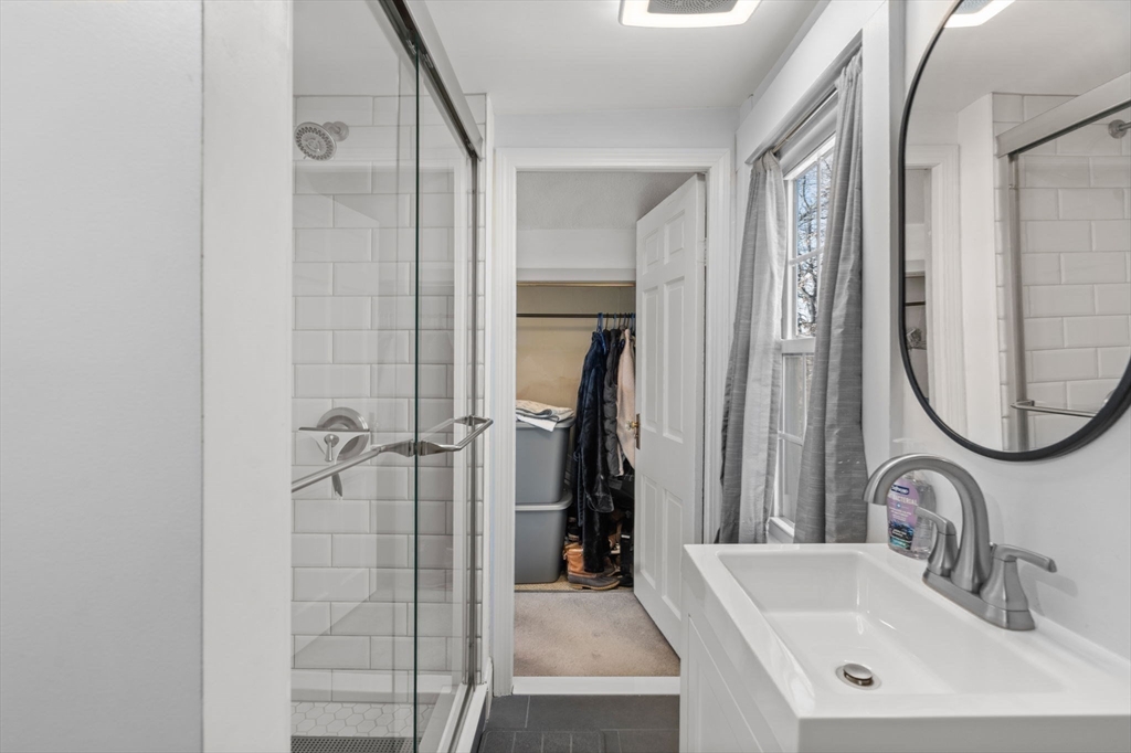 11 Cogswell Road North Reading, MA 01864 - Photo 11 of 29 a bathroom with a sink and a mirror