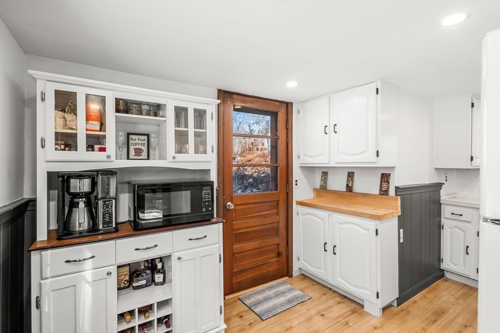 11 Cogswell Road North Reading, MA 01864 - Photo 22 of 29 a kitchen with stainless steel appliances granite countertop a stove and a refrigerator