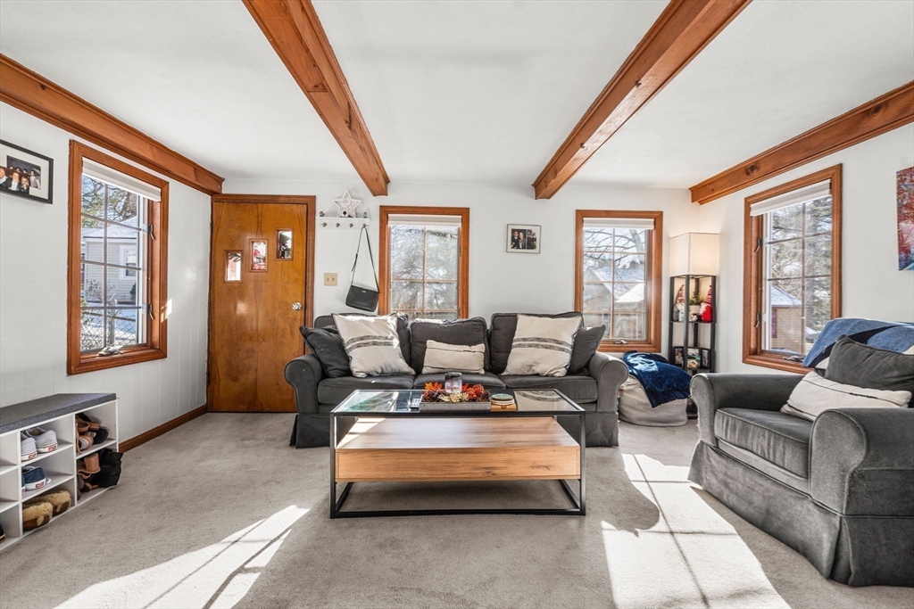 11 Cogswell Road North Reading, MA 01864 - Photo 25 of 29 a living room with furniture and large windows