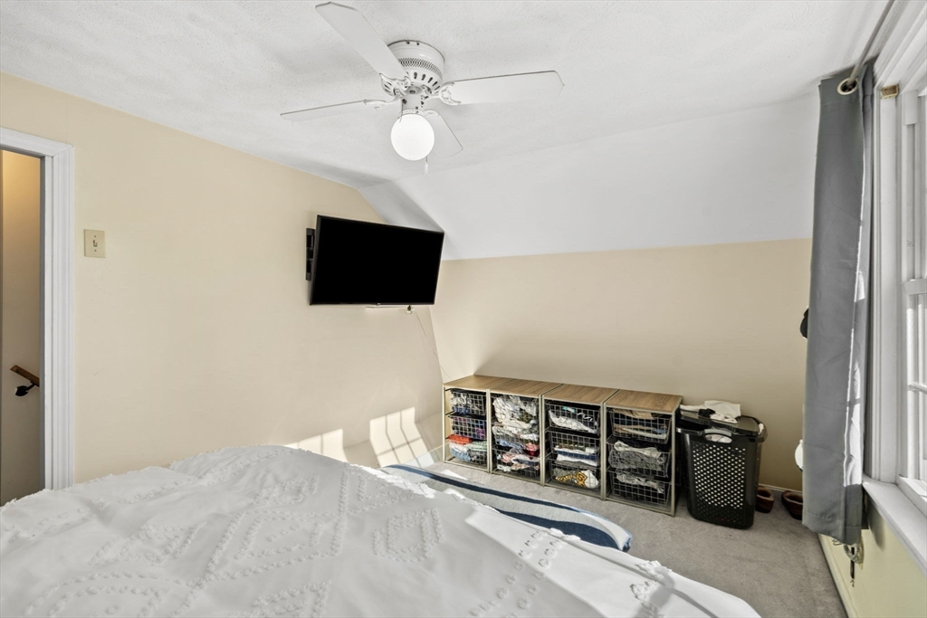 11 Cogswell Road North Reading, MA 01864 - Photo 7 of 29 a living room with furniture and a flat screen tv