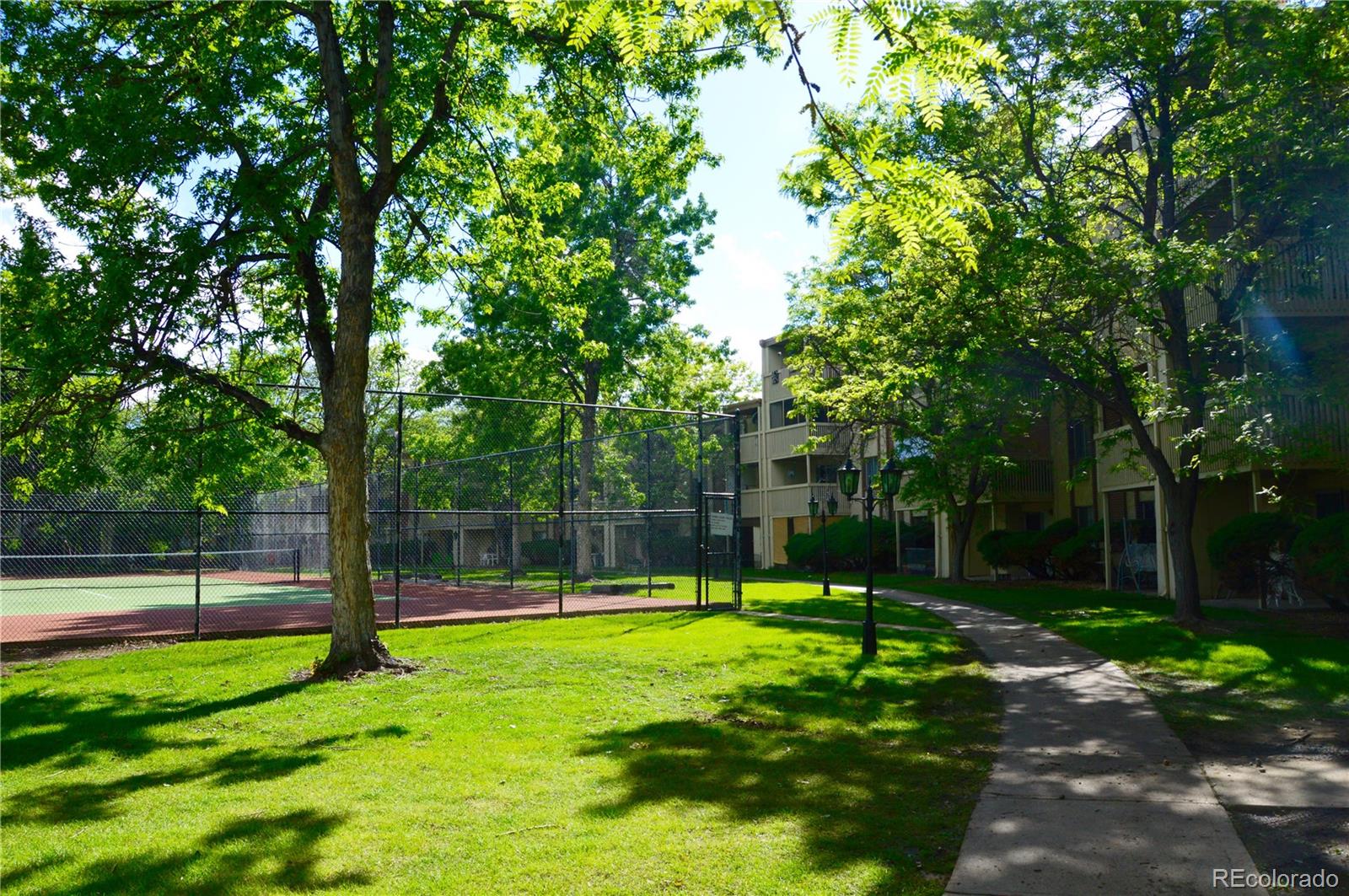 1302 South Parker Road, Unit 336 Denver, CO 80231 - Photo 3 of 9 a view of a park with large trees