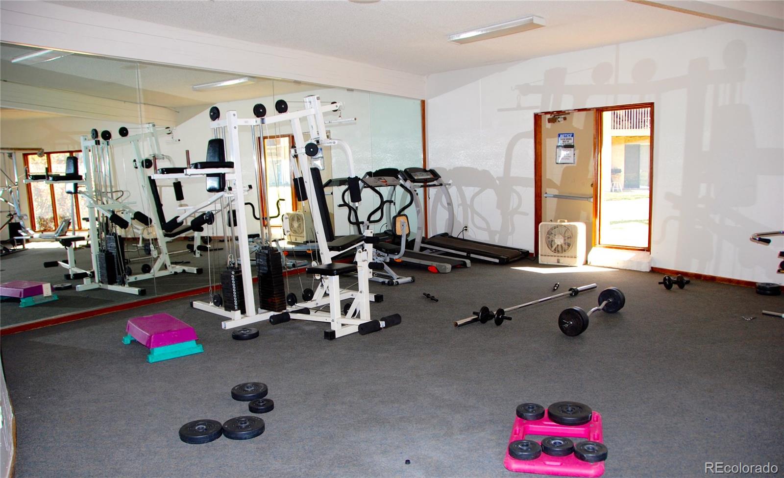 1302 South Parker Road, Unit 336 Denver, CO 80231 - Photo 7 of 9 a view of a room with gym equipment