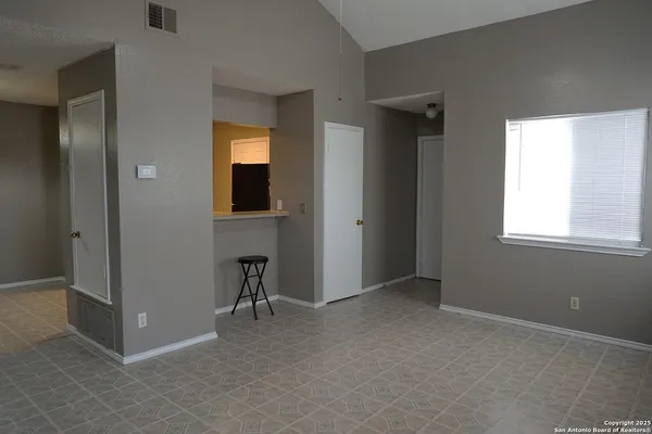 an empty room that has a window