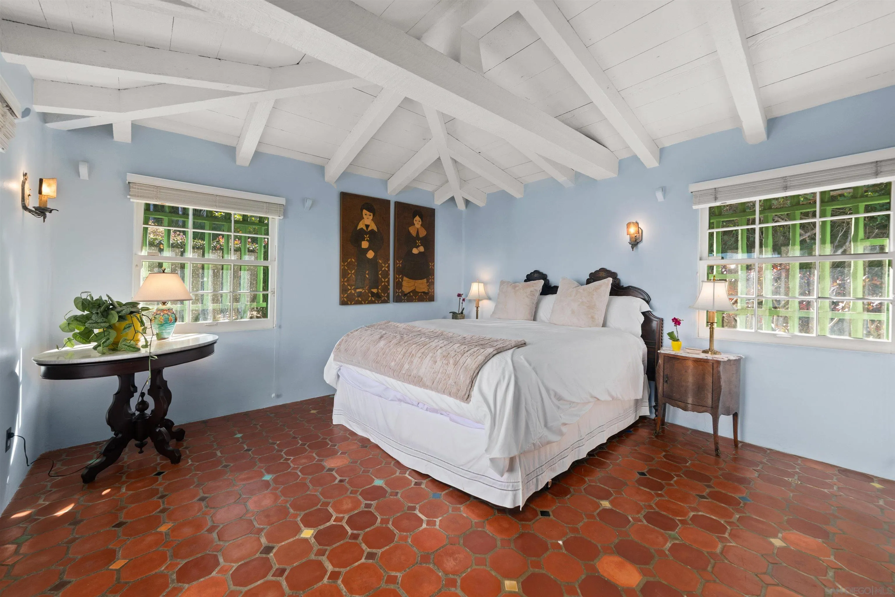 7477 Hillside Drive La Jolla, CA 92037 - Photo 13 of 25 a bedroom with a bed and a table in it