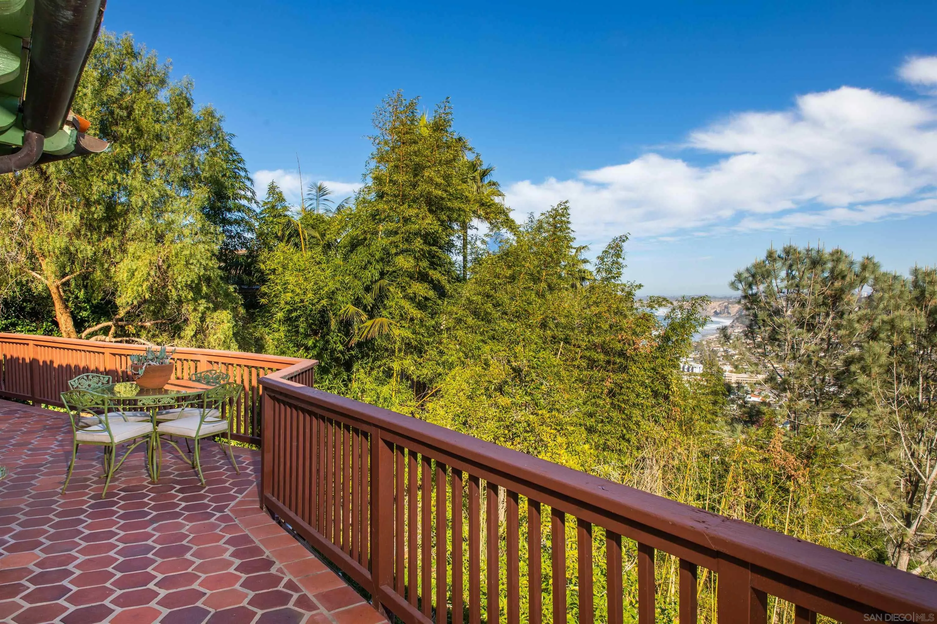 7477 Hillside Drive La Jolla, CA 92037 - Photo 17 of 25 a balcony with wooden floor and fence
