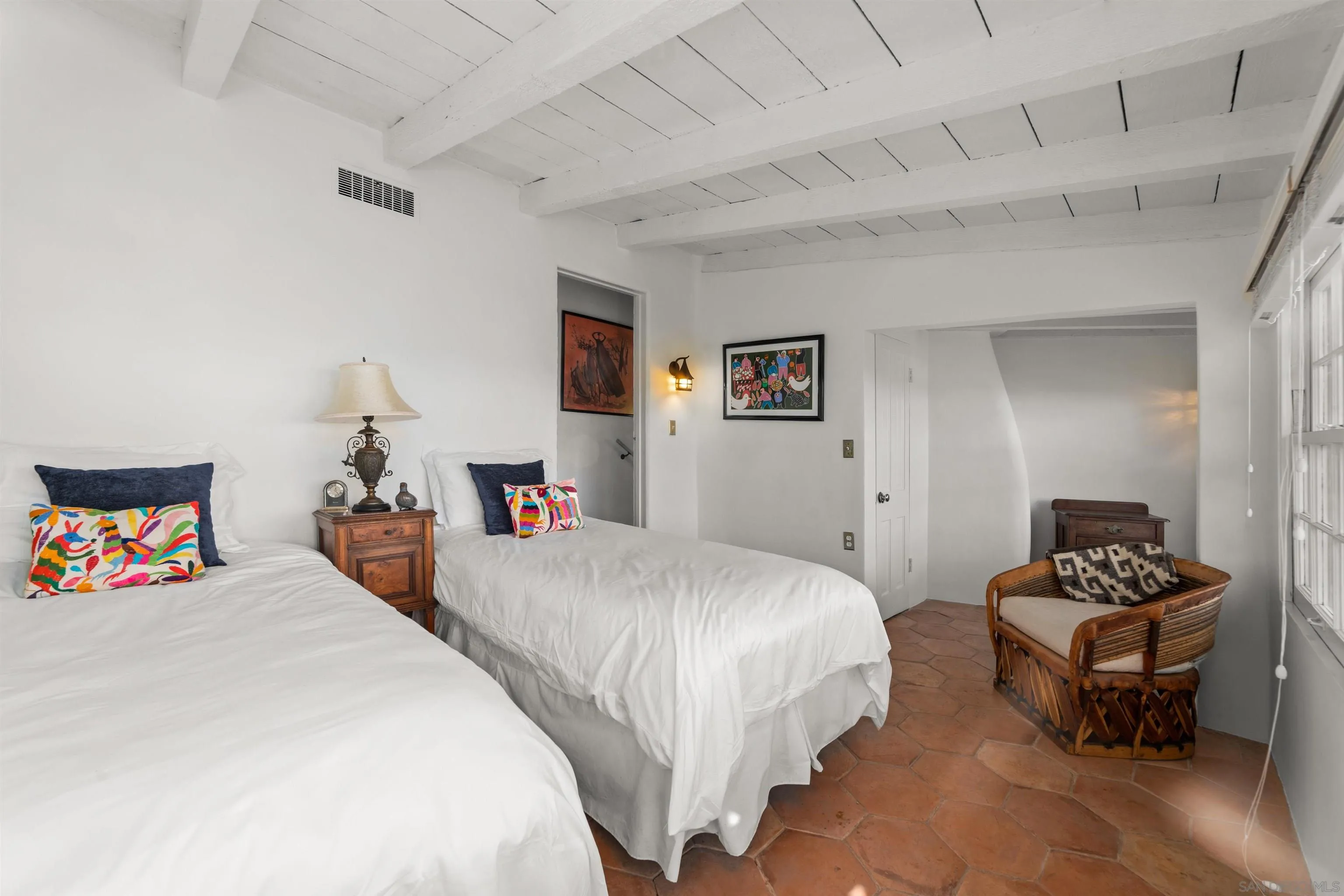 7477 Hillside Drive La Jolla, CA 92037 - Photo 10 of 25 a bedroom with bed and a table