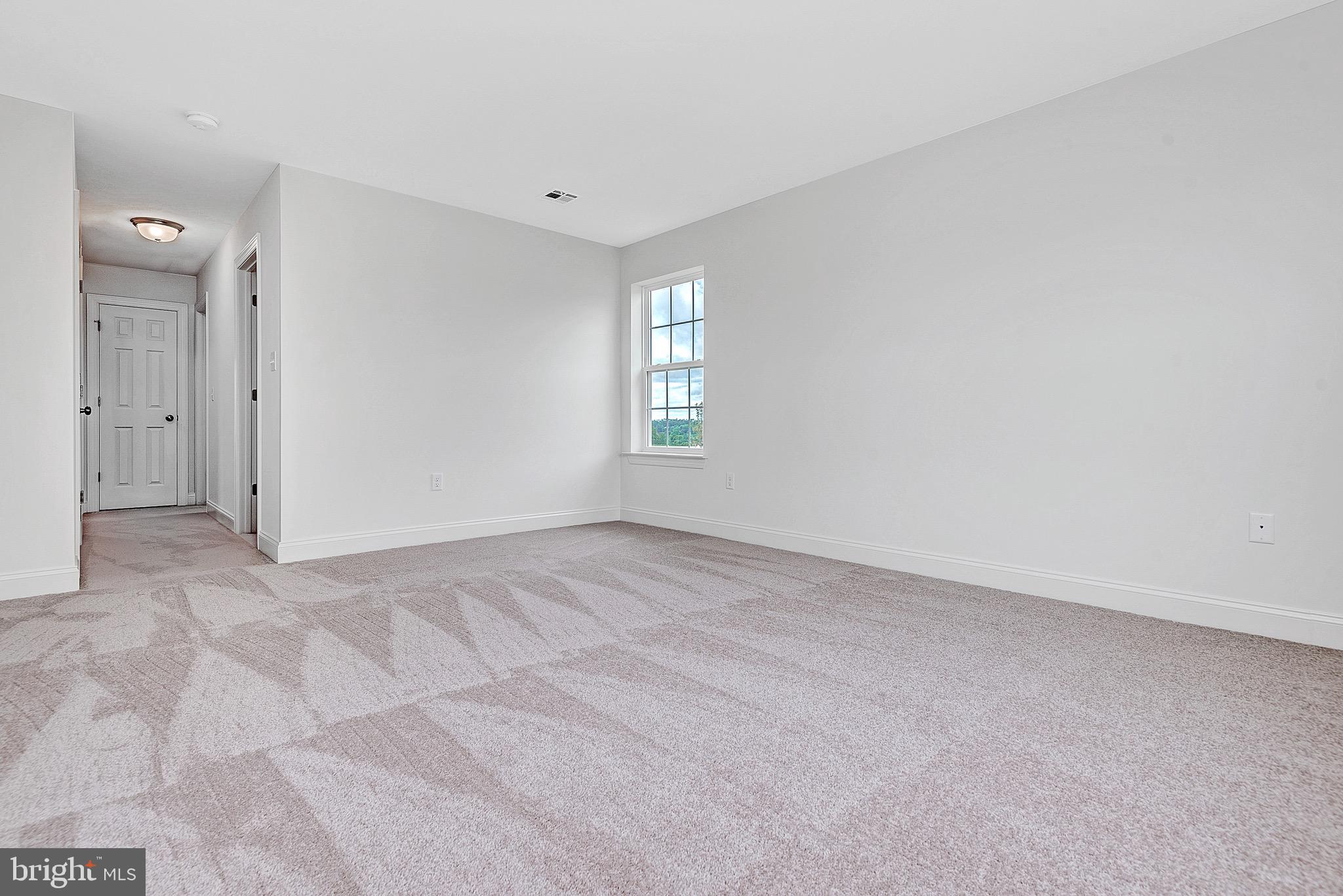 217 Eagle Road Newtown, PA 18940 - Photo 22 of 41 an empty room with windows and closet