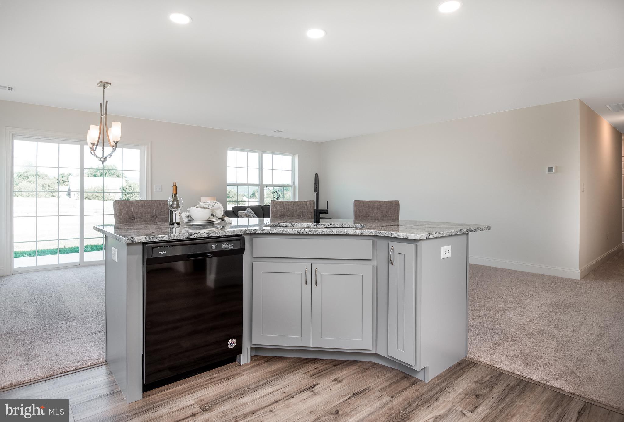 217 Eagle Road Newtown, PA 18940 - Photo 7 of 41 a kitchen with granite countertop a sink cabinets and window