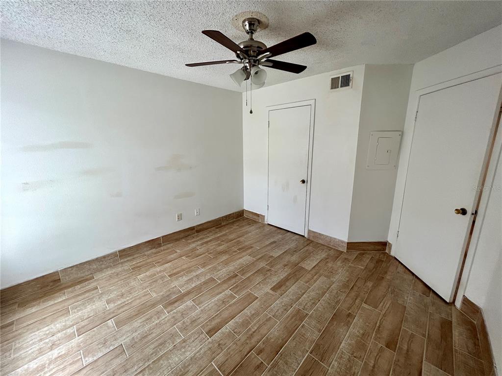 8758 Mallard Reserve Drive, Unit 102 Tampa, FL 33614 - Photo 11 of 17 a view of empty room with a ceiling fan