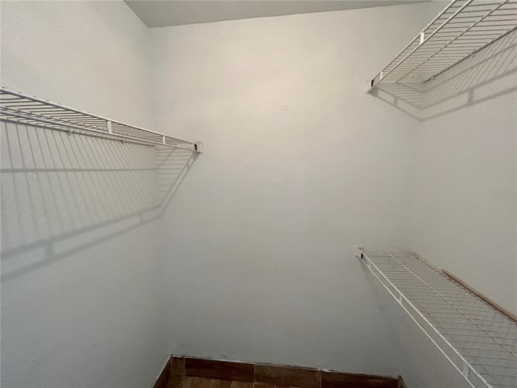 8758 Mallard Reserve Drive, Unit 102 Tampa, FL 33614 - Photo 13 of 17 a view of small space with racks on the wall