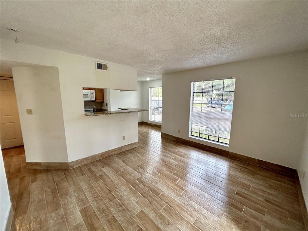 8758 Mallard Reserve Drive, Unit 102 Tampa, FL 33614 - Photo 10 of 17 a view of a kitchen with microwave and cabinets