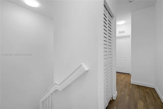 a view of balcony with wooden floor