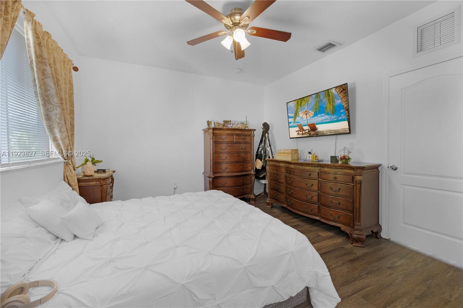 8525 Southwest 214th Terrace Cutler Bay, FL 33189 - Photo 14 of 35 a bedroom with a bed and furniture