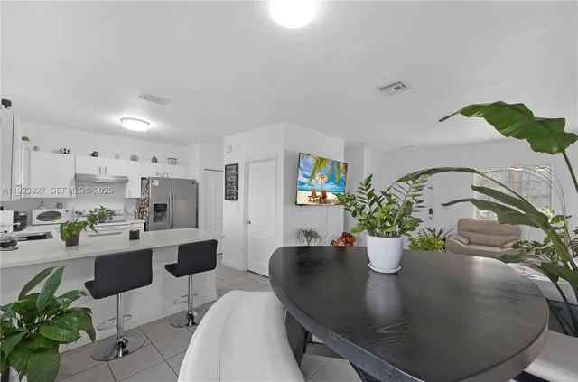 a view of a living room and dining room
