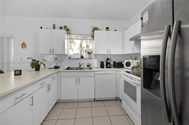 a kitchen with cabinets and appliances