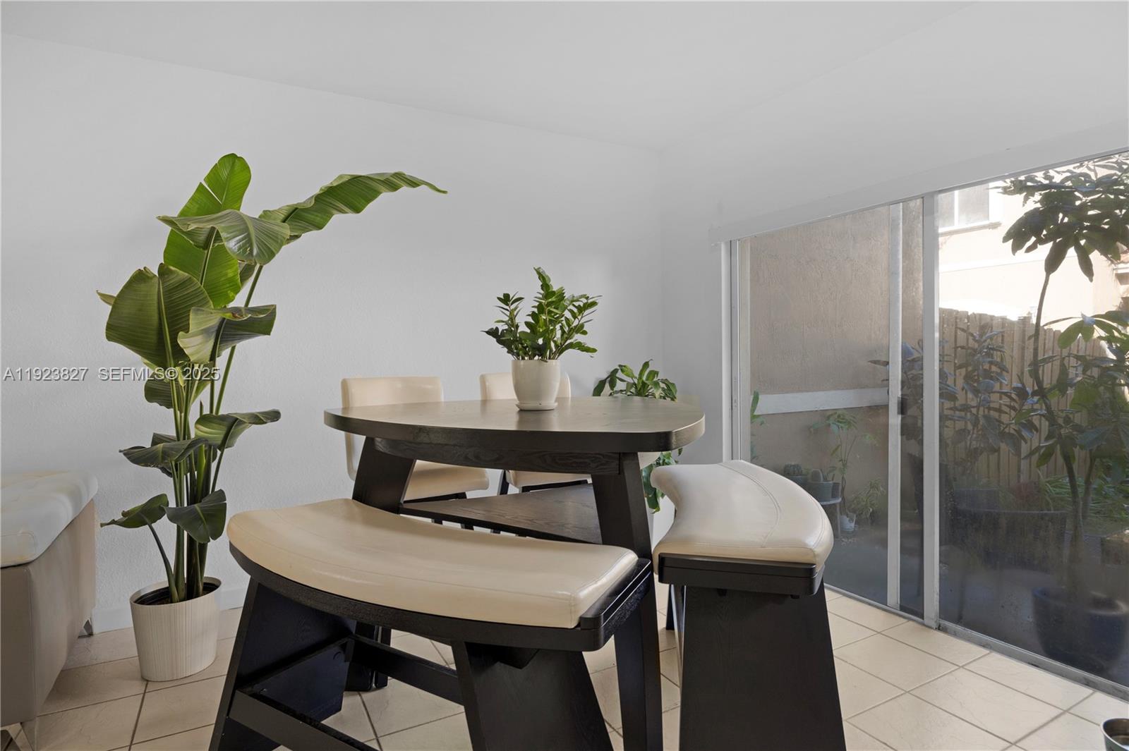 8525 Southwest 214th Terrace Cutler Bay, FL 33189 - Photo 25 of 35 a view of a dining room with furniture window and wooden floor