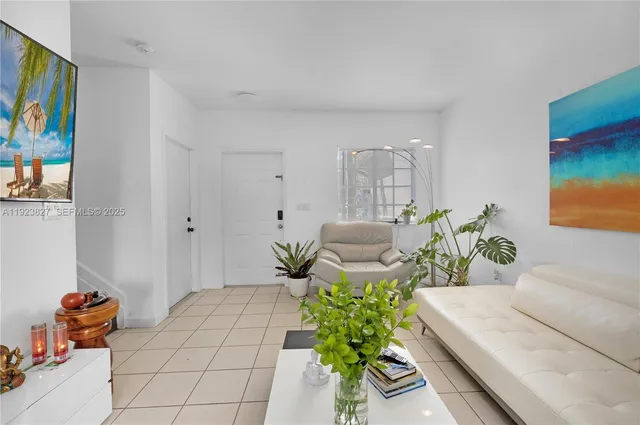 a living room with furniture flowerpot and flower pot