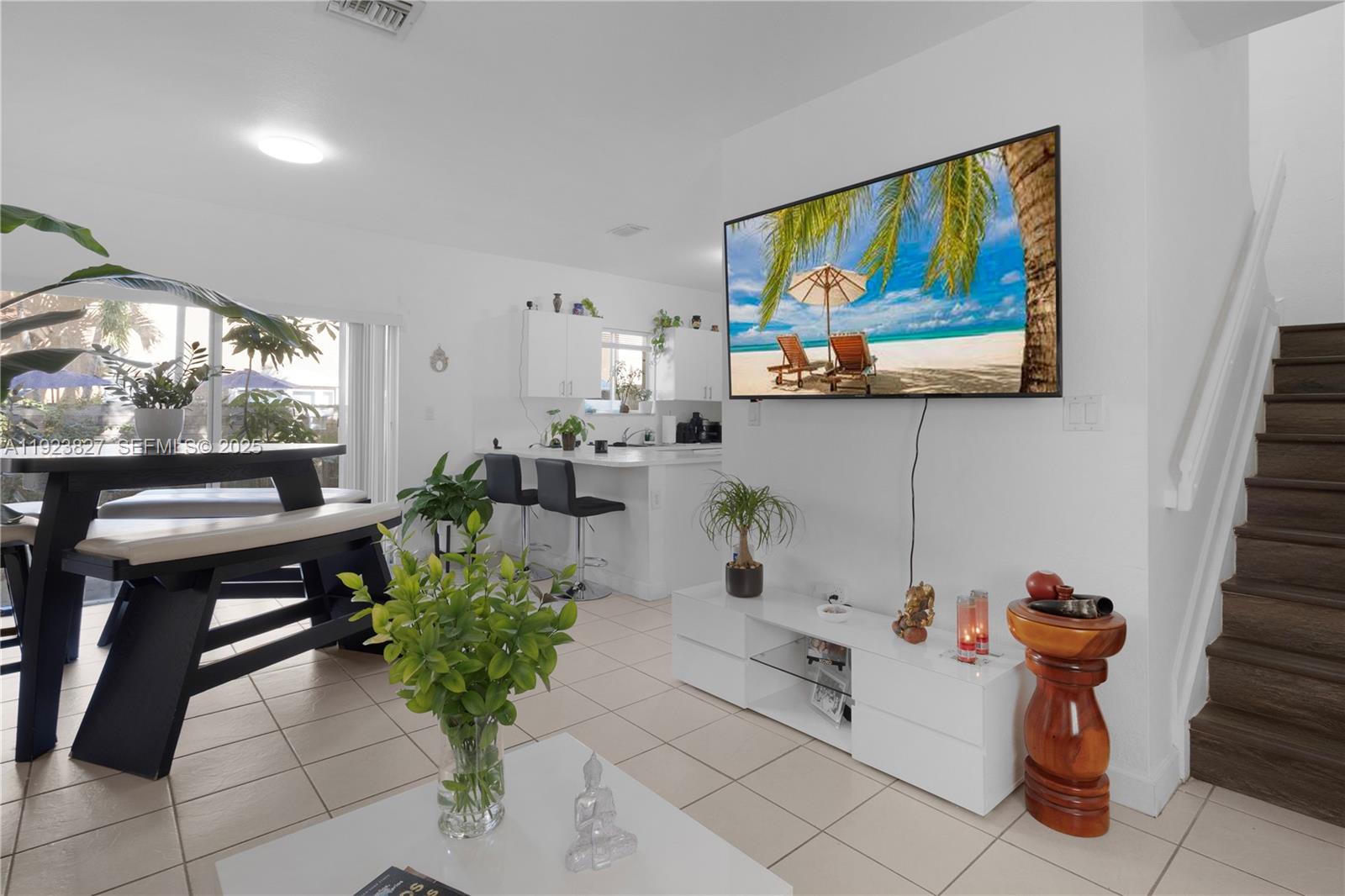 8525 Southwest 214th Terrace Cutler Bay, FL 33189 - Photo 29 of 35 a living room with furniture and a potted plant