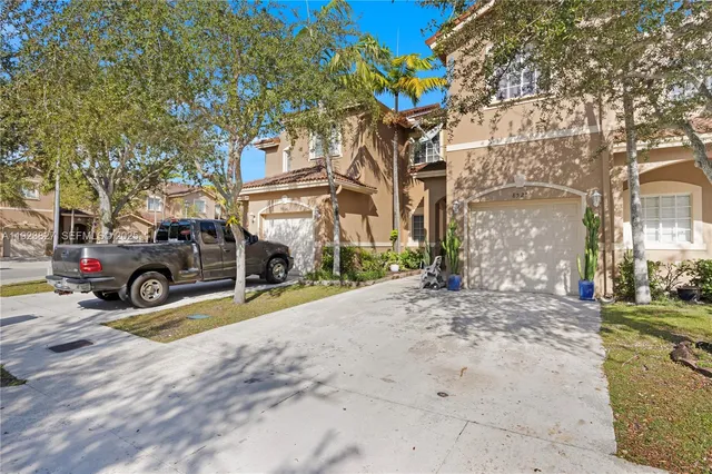 a view of a parked car in front of a building