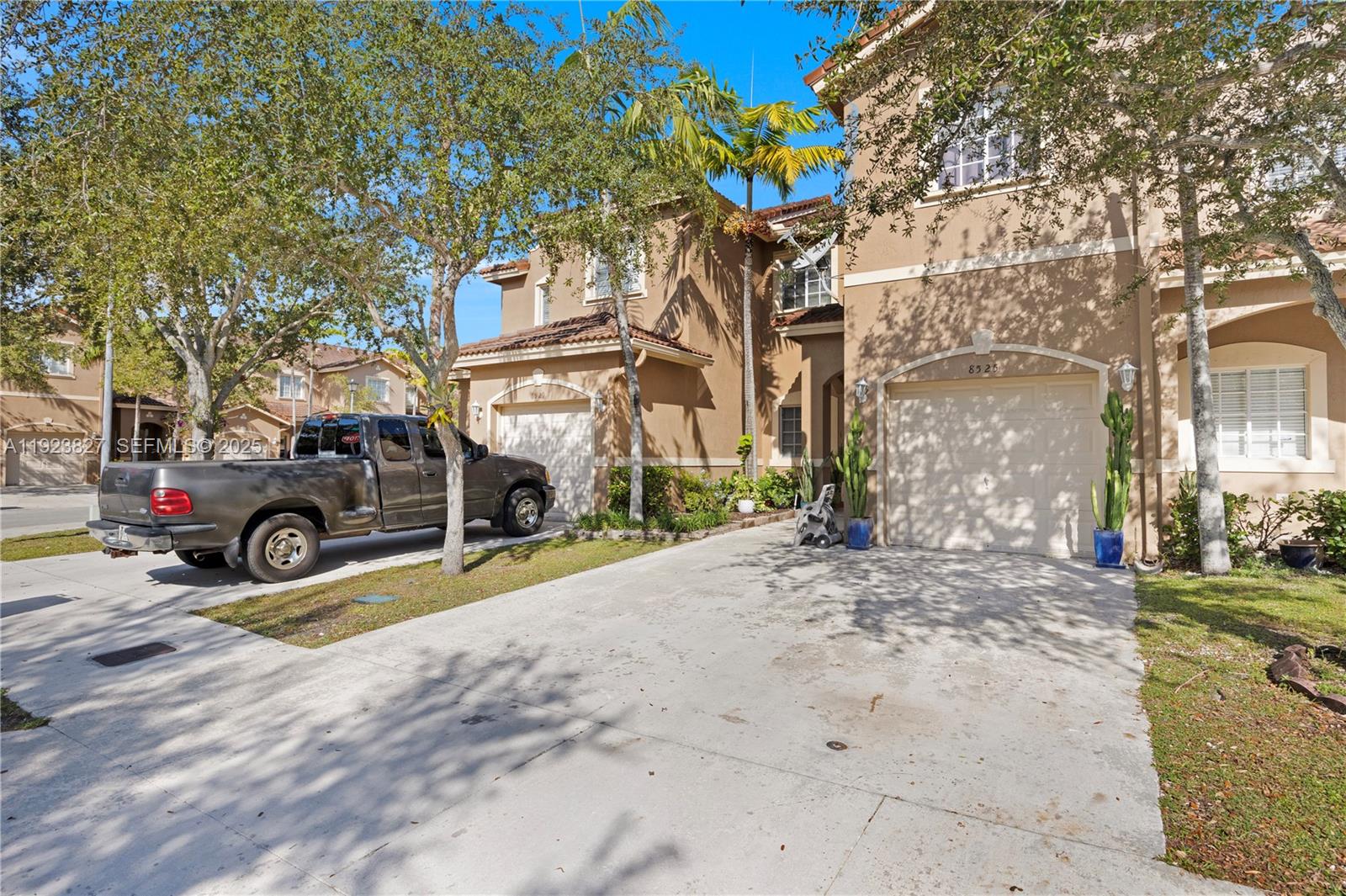 8525 Southwest 214th Terrace Cutler Bay, FL 33189 - Photo 3 of 35 a view of a parked car in front of a building