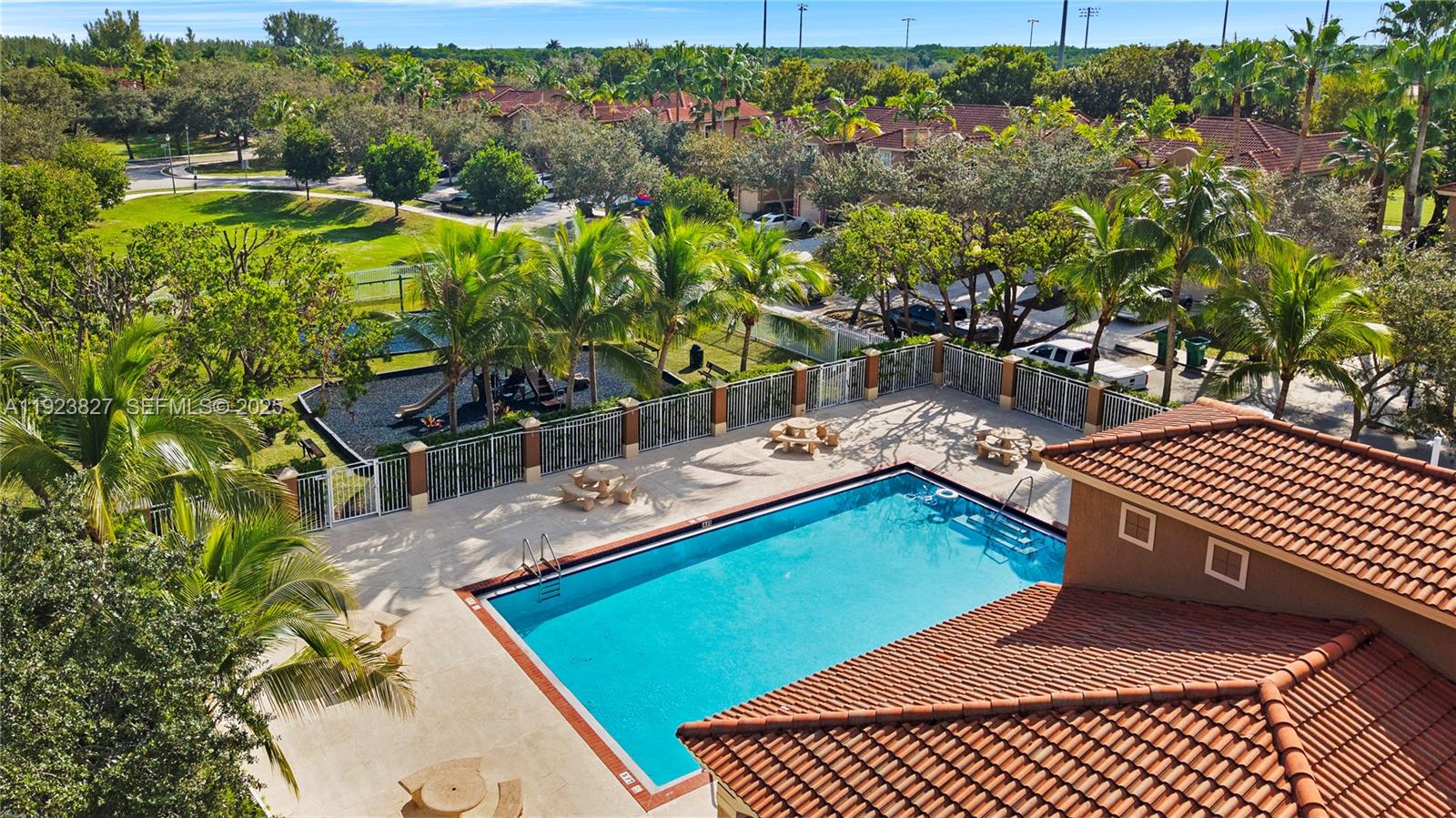 8525 Southwest 214th Terrace Cutler Bay, FL 33189 - Photo 33 of 35 a view of a chairs and table on the patio