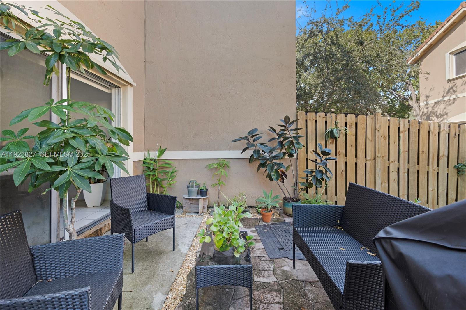 8525 Southwest 214th Terrace Cutler Bay, FL 33189 - Photo 4 of 35 a outdoor living room with furniture