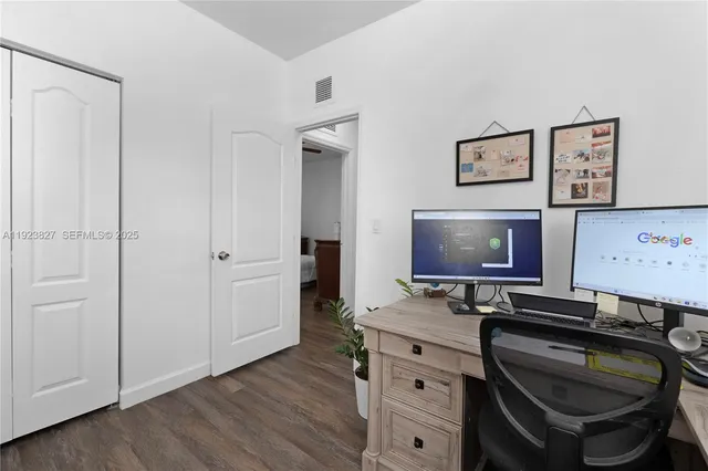 a room with a chair and storage space