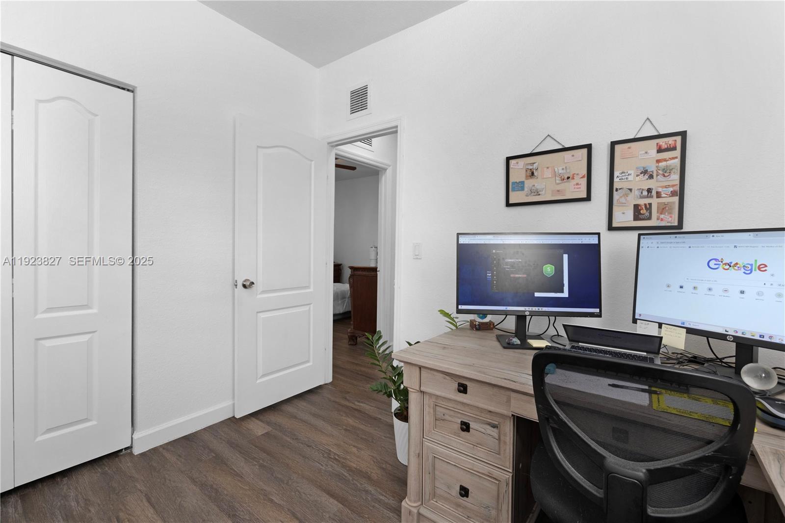 8525 Southwest 214th Terrace Cutler Bay, FL 33189 - Photo 9 of 35 a room with a chair and storage space