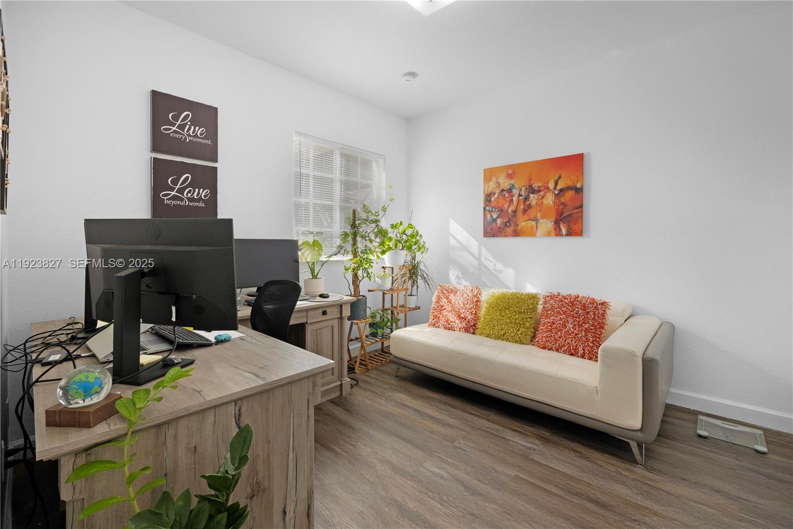 8525 Southwest 214th Terrace Cutler Bay, FL 33189 - Photo 10 of 35 a living room with furniture and a wooden floor