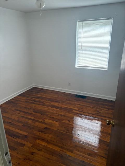 102 Carver Avenue Northwest Roanoke, VA 24012 - Photo 11 of 14 a view of an empty room with wooden floor and a window
