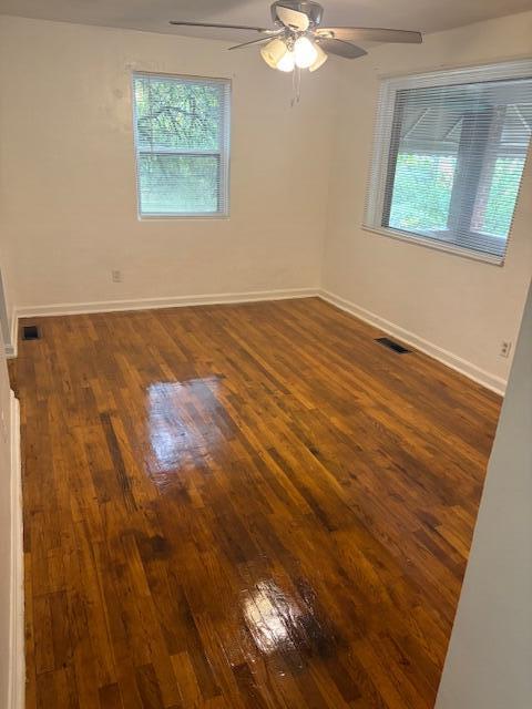 102 Carver Avenue Northwest Roanoke, VA 24012 - Photo 4 of 14 a view of an empty room with window and chandelier fan