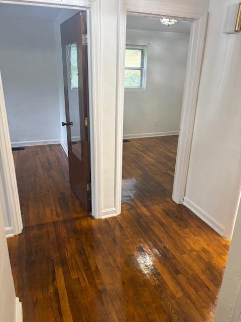 102 Carver Avenue Northwest Roanoke, VA 24012 - Photo 5 of 14 an empty room with wooden floor and entrance