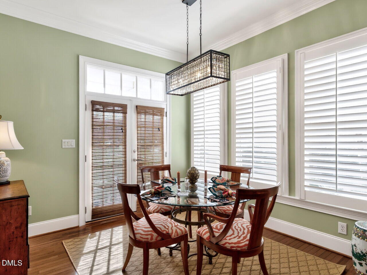 8409 Passage Marseille Court Raleigh, NC 27615 - Photo 13 of 48 a view of a dining room with furniture and windows