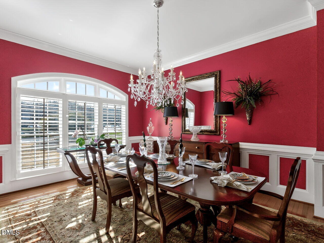 8409 Passage Marseille Court Raleigh, NC 27615 - Photo 14 of 48 a view of a dining room with furniture and chandelier