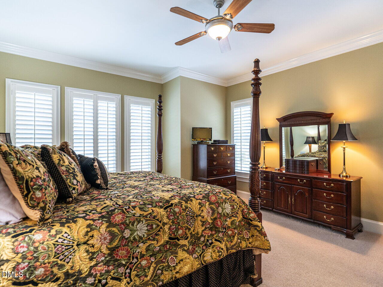 8409 Passage Marseille Court Raleigh, NC 27615 - Photo 23 of 48 a bedroom with a bed and wooden floor