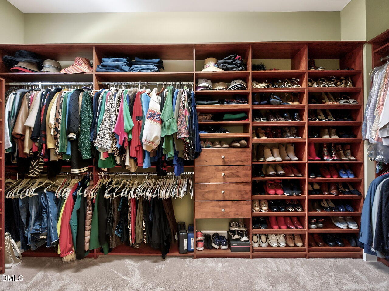 8409 Passage Marseille Court Raleigh, NC 27615 - Photo 26 of 48 a view of walk in closet with clothes and shoes