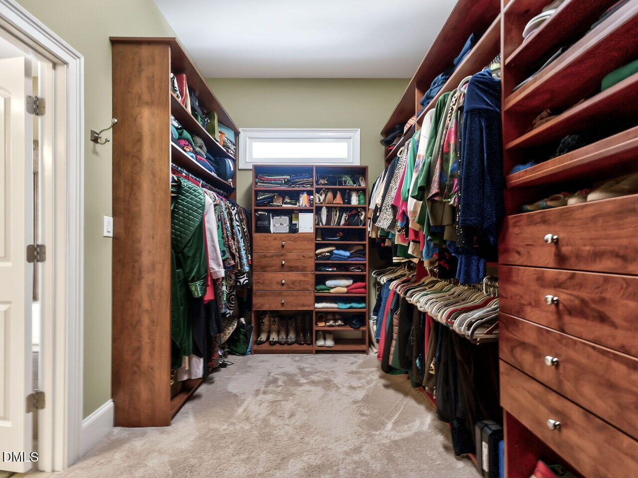 8409 Passage Marseille Court Raleigh, NC 27615 - Photo 27 of 48 a view of walk in closet with clothes and shoes
