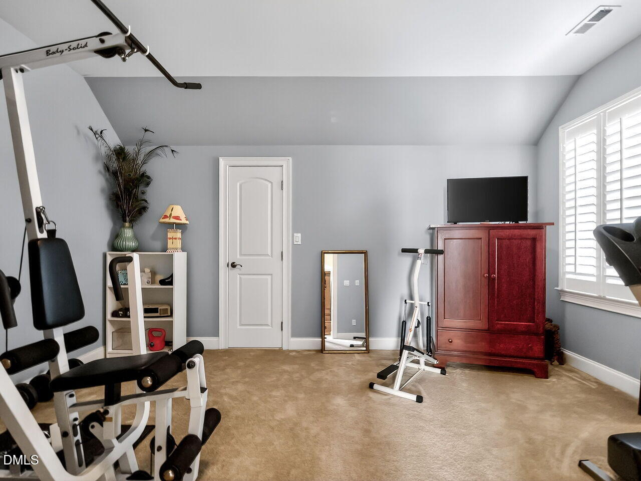 8409 Passage Marseille Court Raleigh, NC 27615 - Photo 30 of 48 a view of a room with gym equipment