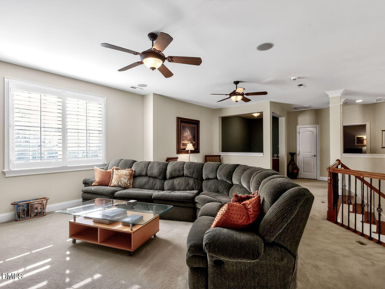 8409 Passage Marseille Court Raleigh, NC 27615 - Photo 32 of 48 a living room with furniture ceiling fan and a window
