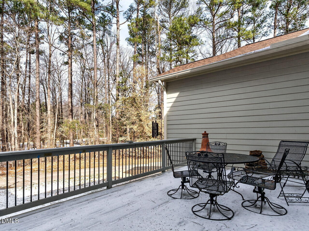 8409 Passage Marseille Court Raleigh, NC 27615 - Photo 38 of 48 a view of a patio with table and chairs and wooden fence