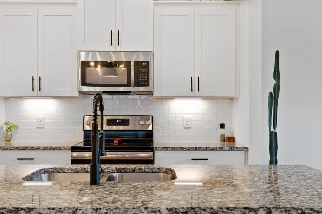a kitchen with a stove and a microwave