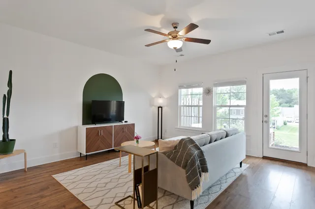 a living room with furniture and a window
