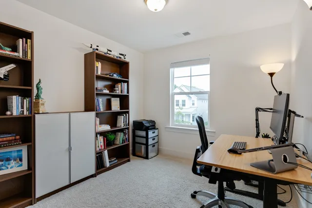 a view of a workspace with furniture and toys
