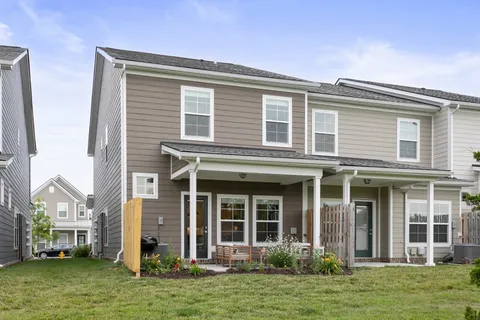 front view of a house with a yard