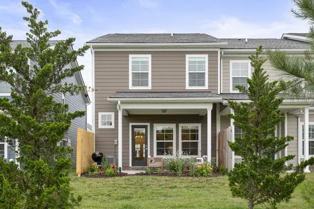front view of a house with a yard