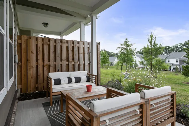 a view of a patio with a table and chairs